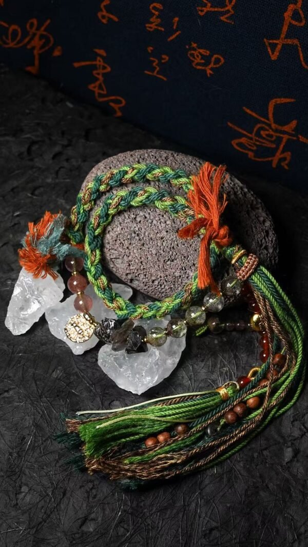 Taurus Earth-Weaved Calm Bracelet — Green & Soft Brown × Woven Stability Colors speak to the grounded heart of Taurus: this bracelet weaves invisible emotions of growth, abundance, and steady calm into tangible color—with lush green and warm soft brown as the foundation. Inspired by Earth’s quiet strength, every strand of natural silk and each crystal is chosen to mirror Taurus’ need for security, progress, and emotional rootedness. It’s not just jewelry; it’s a wearable reminder of your ability to grow slowly, thrive steadily, and hold space for calm. ✨ Emotional Weaving (Color × Feeling)This bracelet uses earthy hues to amplify: Green: The energy of growth — nurtures ambition, attracts abundance, and fosters patience as things unfold naturally. Soft Brown: The anchor of stability — grounds scattered thoughts, builds emotional security, and reminds you of your unshakable foundation. Together, green and soft brown create an emotional synergy: growth without rush, abundance with gratitude, and calm that lasts through change. 🪨 Crystal Color & EnergyEach crystal echoes the bracelet’s earthy color story and enhances Taurus-aligned emotions:• Green Phantom Quartz (Primary Stone) — Lush green tones mirror the cord’s growth energy; attracts wealth, supports personal development, and turns dreams into tangible progress.• Additional Green Phantom Quartz — Deepens the green color palette; amplifies abundance energy and strengthens connection to Earth’s grounding force.• Rose Quartz — Soft pink hues complement green & brown; adds gentle warmth, fostering self-compassion amid growth.• Smoky Quartz — Muted brown tones align with the soft brown cord; grounds excess energy, reduces stress, and enhances emotional stability. 🧵 Color-Centric CraftHandwoven with 100% natural silk cord — smooth, earthy, and designed to let nature’s hues shine: Rich, forest-inspired green cord: The star of the design, chosen for its association with growth, prosperity, and Taurus’ love of nature. Warm soft brown thread accents: Adds depth and calm, balancing green’s vitality with a sense of rooted security. Intention-driven knots: Each weave ties color to emotion, so wearing it becomes a daily practice of "activating" steady growth and calm. 🌿 Wear Your EmotionThis bracelet is a color-coded emotional tool for Taurus’ grounded spirit: Wear it when you need patience (e.g., long-term projects, personal growth journeys). Let green and brown remind you to trust the process—growth takes time, and stability is your superpower. Pair it with earthy tones or neutrals to amplify its natural, calm energy. 🎁 Gift Meaning"May this green nurture your growth, and this brown steady your path — thrive in calm, grow in abundance."Perfect for Taurus, nature lovers, anyone seeking stability, or those wanting to align with Earth’s quiet strength.