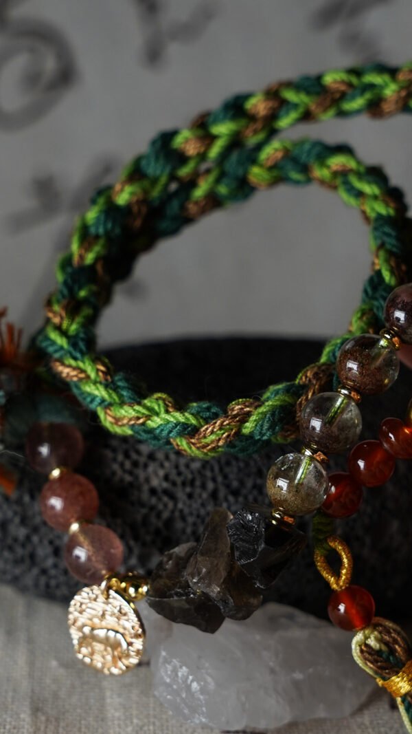 Taurus Earth-Weaved Calm Bracelet — Green & Soft Brown × Woven Stability Colors speak to the grounded heart of Taurus: this bracelet weaves invisible emotions of growth, abundance, and steady calm into tangible color—with lush green and warm soft brown as the foundation. Inspired by Earth’s quiet strength, every strand of natural silk and each crystal is chosen to mirror Taurus’ need for security, progress, and emotional rootedness. It’s not just jewelry; it’s a wearable reminder of your ability to grow slowly, thrive steadily, and hold space for calm. ✨ Emotional Weaving (Color × Feeling)This bracelet uses earthy hues to amplify: Green: The energy of growth — nurtures ambition, attracts abundance, and fosters patience as things unfold naturally. Soft Brown: The anchor of stability — grounds scattered thoughts, builds emotional security, and reminds you of your unshakable foundation. Together, green and soft brown create an emotional synergy: growth without rush, abundance with gratitude, and calm that lasts through change. 🪨 Crystal Color & EnergyEach crystal echoes the bracelet’s earthy color story and enhances Taurus-aligned emotions:• Green Phantom Quartz (Primary Stone) — Lush green tones mirror the cord’s growth energy; attracts wealth, supports personal development, and turns dreams into tangible progress.• Additional Green Phantom Quartz — Deepens the green color palette; amplifies abundance energy and strengthens connection to Earth’s grounding force.• Rose Quartz — Soft pink hues complement green & brown; adds gentle warmth, fostering self-compassion amid growth.• Smoky Quartz — Muted brown tones align with the soft brown cord; grounds excess energy, reduces stress, and enhances emotional stability. 🧵 Color-Centric CraftHandwoven with 100% natural silk cord — smooth, earthy, and designed to let nature’s hues shine: Rich, forest-inspired green cord: The star of the design, chosen for its association with growth, prosperity, and Taurus’ love of nature. Warm soft brown thread accents: Adds depth and calm, balancing green’s vitality with a sense of rooted security. Intention-driven knots: Each weave ties color to emotion, so wearing it becomes a daily practice of "activating" steady growth and calm. 🌿 Wear Your EmotionThis bracelet is a color-coded emotional tool for Taurus’ grounded spirit: Wear it when you need patience (e.g., long-term projects, personal growth journeys). Let green and brown remind you to trust the process—growth takes time, and stability is your superpower. Pair it with earthy tones or neutrals to amplify its natural, calm energy. 🎁 Gift Meaning"May this green nurture your growth, and this brown steady your path — thrive in calm, grow in abundance."Perfect for Taurus, nature lovers, anyone seeking stability, or those wanting to align with Earth’s quiet strength.