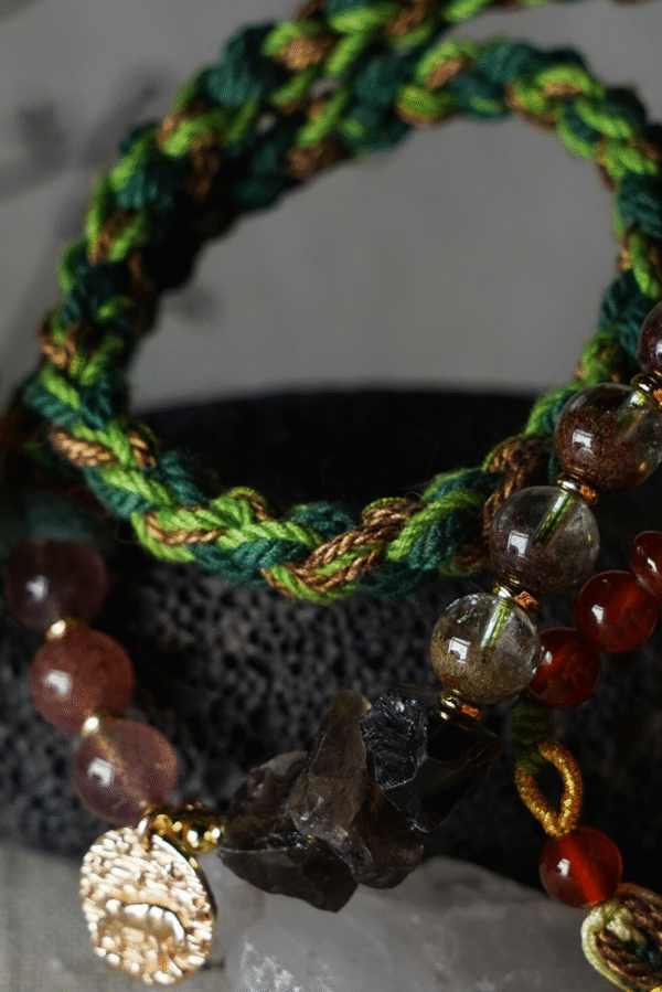 Taurus Earth-Weaved Calm Bracelet — Green & Soft Brown × Woven Stability Colors speak to the grounded heart of Taurus: this bracelet weaves invisible emotions of growth, abundance, and steady calm into tangible color—with lush green and warm soft brown as the foundation. Inspired by Earth’s quiet strength, every strand of natural silk and each crystal is chosen to mirror Taurus’ need for security, progress, and emotional rootedness. It’s not just jewelry; it’s a wearable reminder of your ability to grow slowly, thrive steadily, and hold space for calm. ✨ Emotional Weaving (Color × Feeling)This bracelet uses earthy hues to amplify: Green: The energy of growth — nurtures ambition, attracts abundance, and fosters patience as things unfold naturally. Soft Brown: The anchor of stability — grounds scattered thoughts, builds emotional security, and reminds you of your unshakable foundation. Together, green and soft brown create an emotional synergy: growth without rush, abundance with gratitude, and calm that lasts through change. 🪨 Crystal Color & EnergyEach crystal echoes the bracelet’s earthy color story and enhances Taurus-aligned emotions:• Green Phantom Quartz (Primary Stone) — Lush green tones mirror the cord’s growth energy; attracts wealth, supports personal development, and turns dreams into tangible progress.• Additional Green Phantom Quartz — Deepens the green color palette; amplifies abundance energy and strengthens connection to Earth’s grounding force.• Rose Quartz — Soft pink hues complement green & brown; adds gentle warmth, fostering self-compassion amid growth.• Smoky Quartz — Muted brown tones align with the soft brown cord; grounds excess energy, reduces stress, and enhances emotional stability. 🧵 Color-Centric CraftHandwoven with 100% natural silk cord — smooth, earthy, and designed to let nature’s hues shine: Rich, forest-inspired green cord: The star of the design, chosen for its association with growth, prosperity, and Taurus’ love of nature. Warm soft brown thread accents: Adds depth and calm, balancing green’s vitality with a sense of rooted security. Intention-driven knots: Each weave ties color to emotion, so wearing it becomes a daily practice of "activating" steady growth and calm. 🌿 Wear Your EmotionThis bracelet is a color-coded emotional tool for Taurus’ grounded spirit: Wear it when you need patience (e.g., long-term projects, personal growth journeys). Let green and brown remind you to trust the process—growth takes time, and stability is your superpower. Pair it with earthy tones or neutrals to amplify its natural, calm energy. 🎁 Gift Meaning"May this green nurture your growth, and this brown steady your path — thrive in calm, grow in abundance."Perfect for Taurus, nature lovers, anyone seeking stability, or those wanting to align with Earth’s quiet strength.