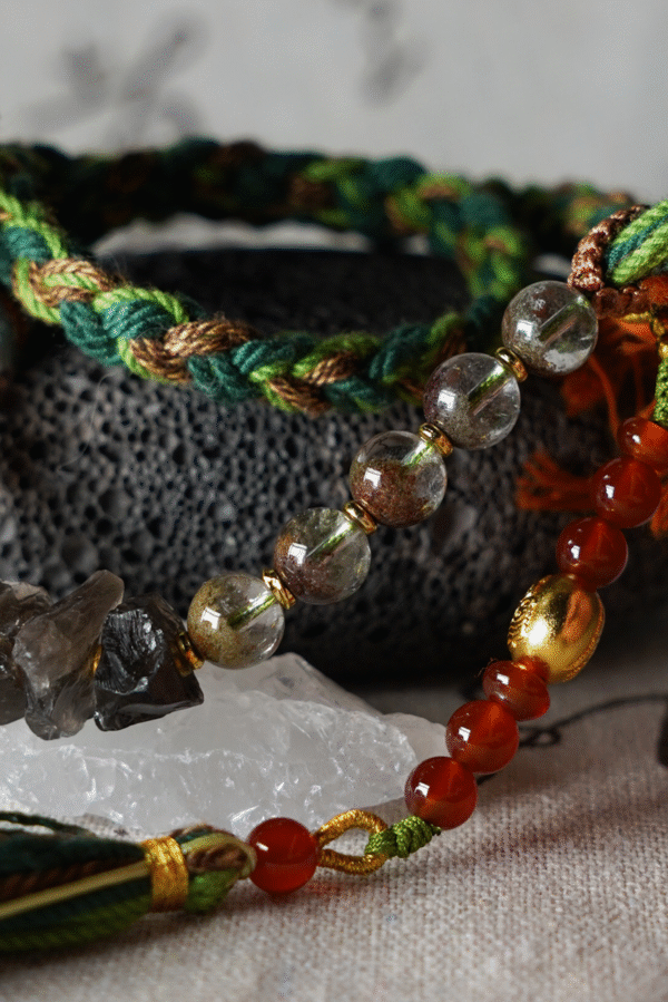 Taurus Earth-Weaved Calm Bracelet — Green & Soft Brown × Woven Stability Colors speak to the grounded heart of Taurus: this bracelet weaves invisible emotions of growth, abundance, and steady calm into tangible color—with lush green and warm soft brown as the foundation. Inspired by Earth’s quiet strength, every strand of natural silk and each crystal is chosen to mirror Taurus’ need for security, progress, and emotional rootedness. It’s not just jewelry; it’s a wearable reminder of your ability to grow slowly, thrive steadily, and hold space for calm. ✨ Emotional Weaving (Color × Feeling)This bracelet uses earthy hues to amplify: Green: The energy of growth — nurtures ambition, attracts abundance, and fosters patience as things unfold naturally. Soft Brown: The anchor of stability — grounds scattered thoughts, builds emotional security, and reminds you of your unshakable foundation. Together, green and soft brown create an emotional synergy: growth without rush, abundance with gratitude, and calm that lasts through change. 🪨 Crystal Color & EnergyEach crystal echoes the bracelet’s earthy color story and enhances Taurus-aligned emotions:• Green Phantom Quartz (Primary Stone) — Lush green tones mirror the cord’s growth energy; attracts wealth, supports personal development, and turns dreams into tangible progress.• Additional Green Phantom Quartz — Deepens the green color palette; amplifies abundance energy and strengthens connection to Earth’s grounding force.• Rose Quartz — Soft pink hues complement green & brown; adds gentle warmth, fostering self-compassion amid growth.• Smoky Quartz — Muted brown tones align with the soft brown cord; grounds excess energy, reduces stress, and enhances emotional stability. 🧵 Color-Centric CraftHandwoven with 100% natural silk cord — smooth, earthy, and designed to let nature’s hues shine: Rich, forest-inspired green cord: The star of the design, chosen for its association with growth, prosperity, and Taurus’ love of nature. Warm soft brown thread accents: Adds depth and calm, balancing green’s vitality with a sense of rooted security. Intention-driven knots: Each weave ties color to emotion, so wearing it becomes a daily practice of "activating" steady growth and calm. 🌿 Wear Your EmotionThis bracelet is a color-coded emotional tool for Taurus’ grounded spirit: Wear it when you need patience (e.g., long-term projects, personal growth journeys). Let green and brown remind you to trust the process—growth takes time, and stability is your superpower. Pair it with earthy tones or neutrals to amplify its natural, calm energy. 🎁 Gift Meaning"May this green nurture your growth, and this brown steady your path — thrive in calm, grow in abundance."Perfect for Taurus, nature lovers, anyone seeking stability, or those wanting to align with Earth’s quiet strength.