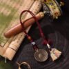 Tibetan Bagua Protection Multi-Use Charm - Yak Bone & Glass Beads Tibetan Bagua Protection Multi-Use Charm - Yak Bone & Glass Beads