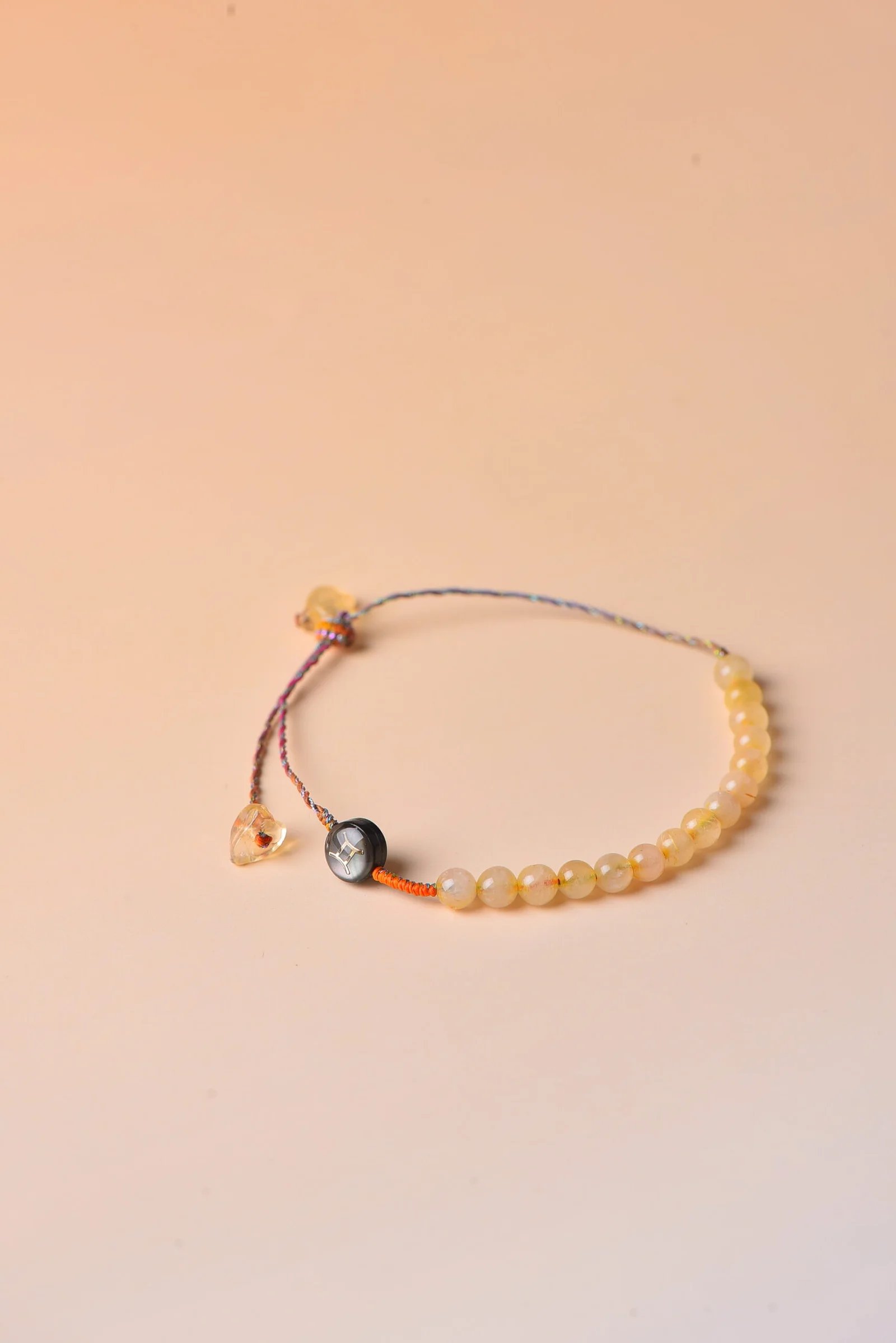 handwoven zodiac bracelet in honey citrine gold with pale stone beads — Zodiac series by TibetanTwist