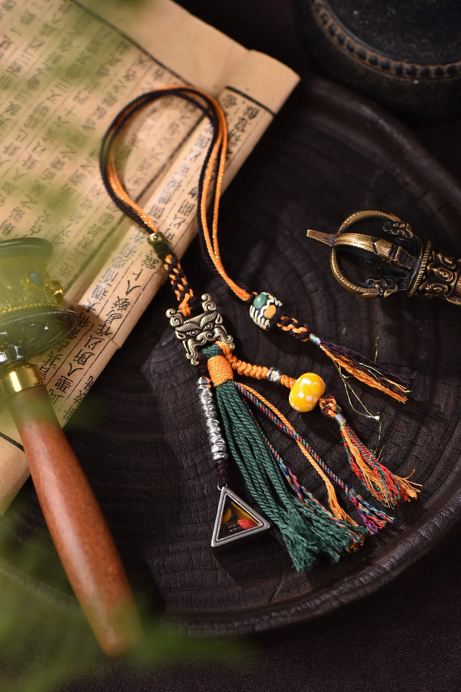 handwoven brass-detailed charm in earth brown and indigo — Tibetan-Inspired by TibetanTwist