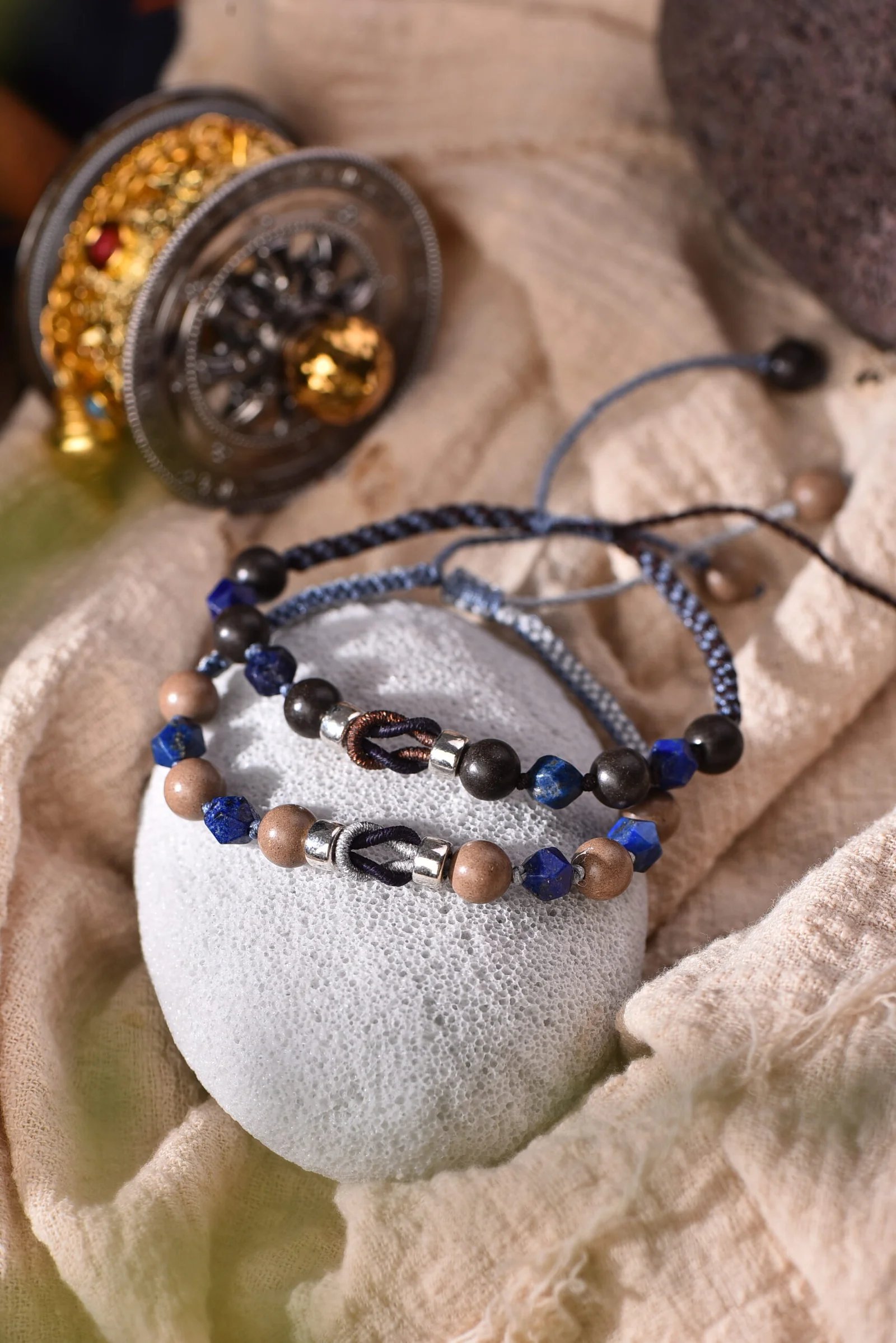 handwoven dual-tone bracelet in monsoon sky blue and deep indigo with sandy wood beads — memory jewelry by TibetanTwist