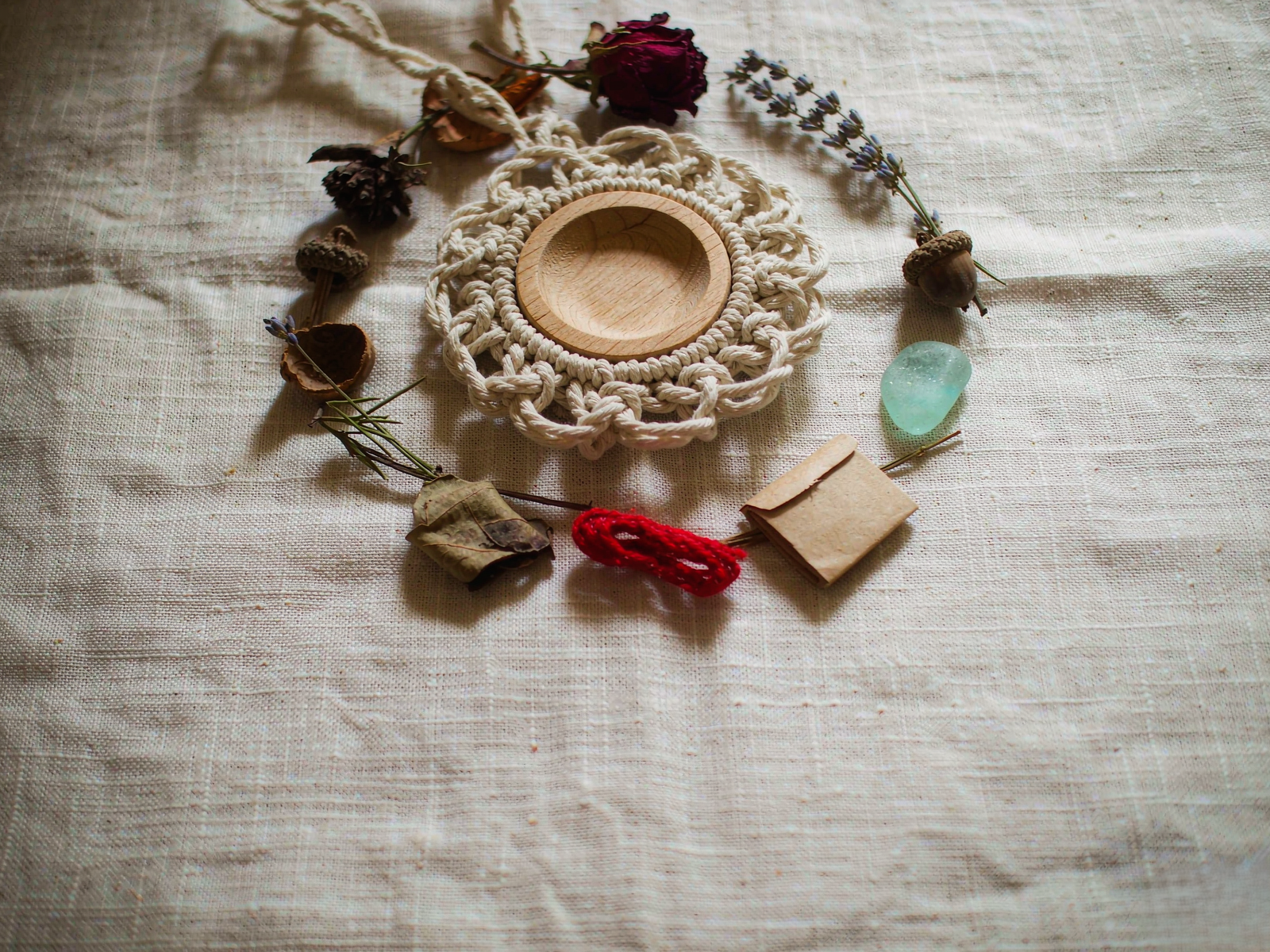 handwoven keepsake pendant with dried rosebud, lavender sprig and small gathered treasures — memory jewelry by TibetanTwist